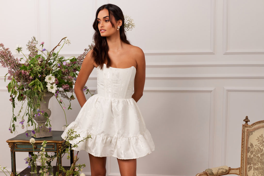 model in the ginny dress in white