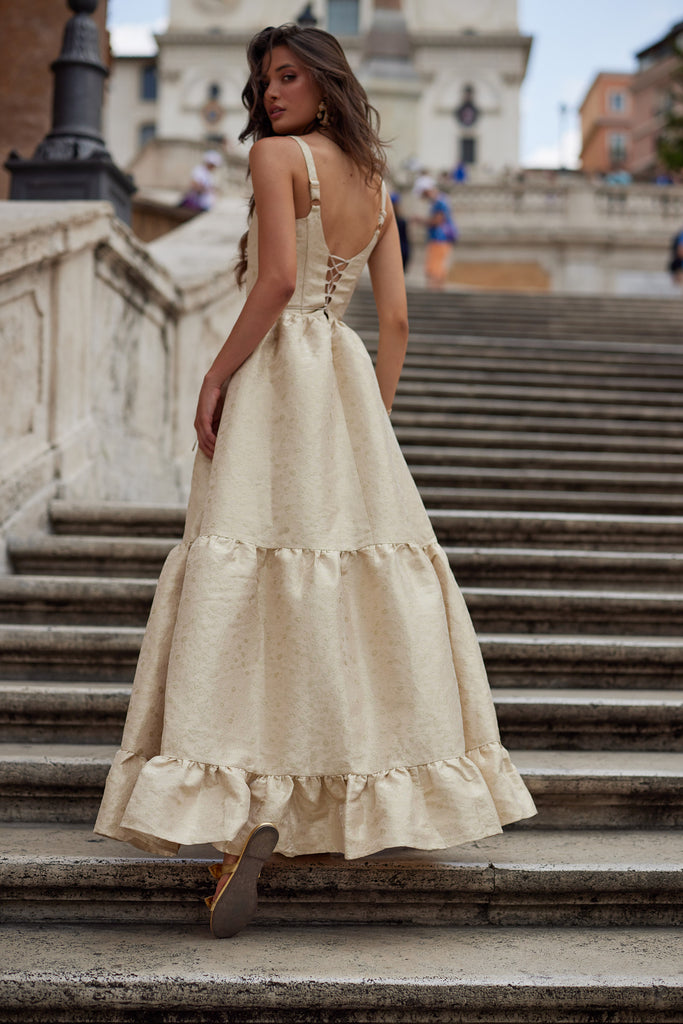 photo of model from the back in the avery dress in taupe duchess