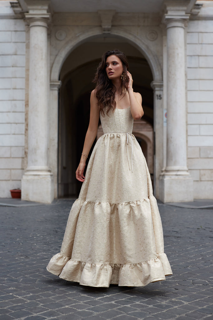 photo of model from the front in the avery dress in taupe duchess