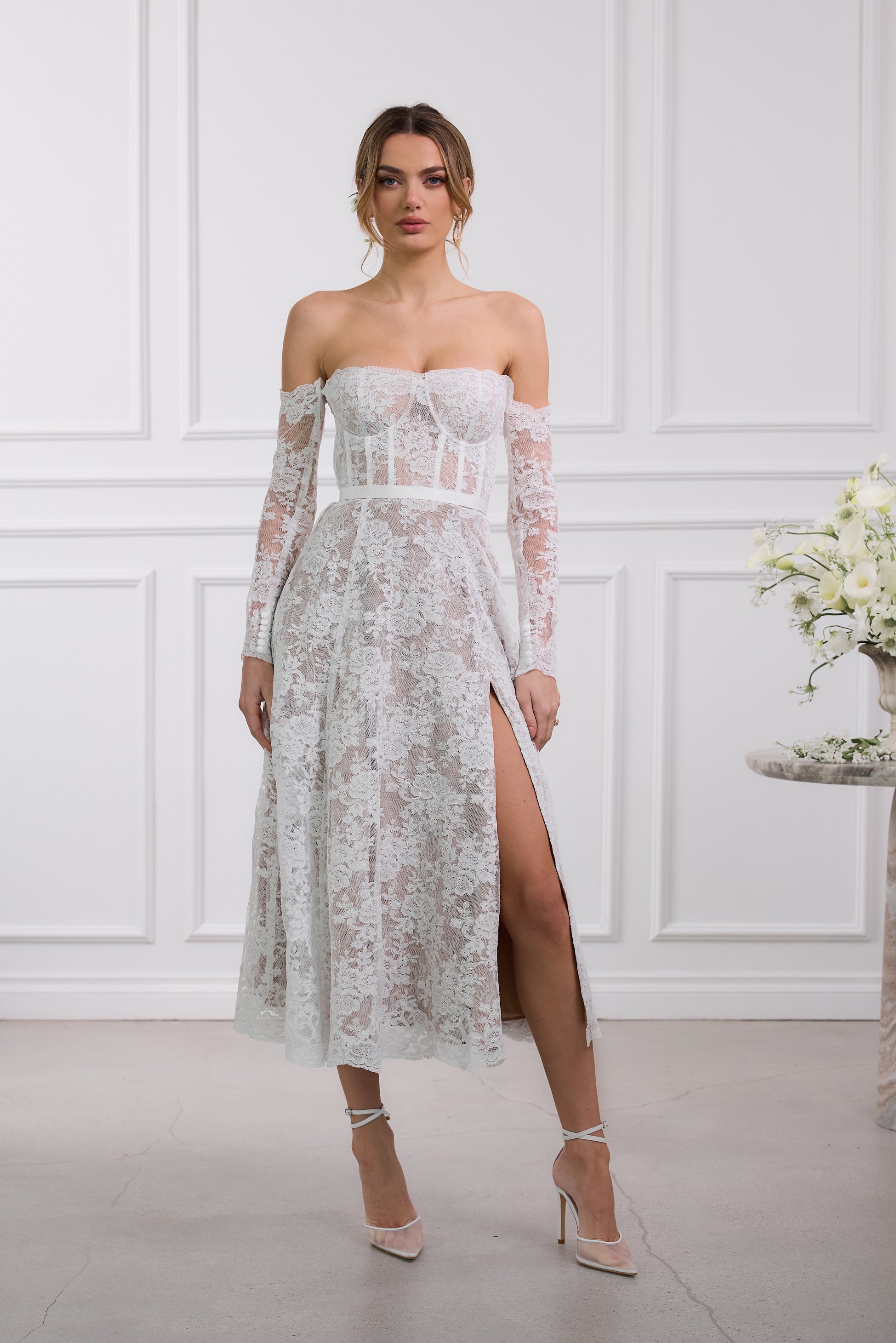 capulet midi dress in white chantilly lace Meet The Capulet Dress in white Chantilly Lace she is made with a built-in corset to keep you cinched and has white satin details that accentuate you in all the right places! Launching soon!!