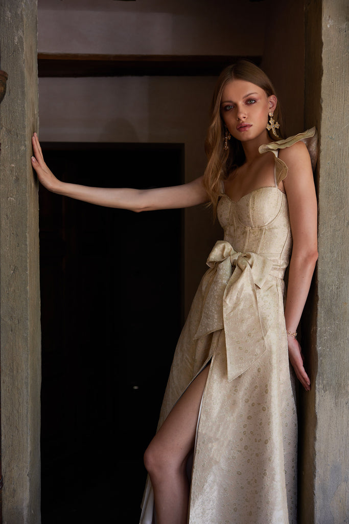 photo of model from the side in the vera dress in taupe duchess