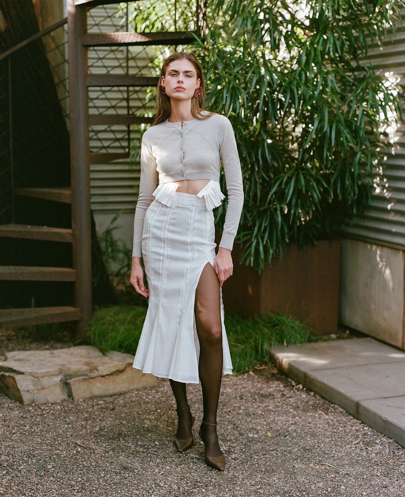 Fitted white look photographed outdoors