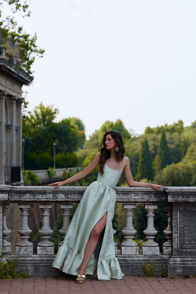 front view photo of model on bridge in the charlotte dress in sage duchess