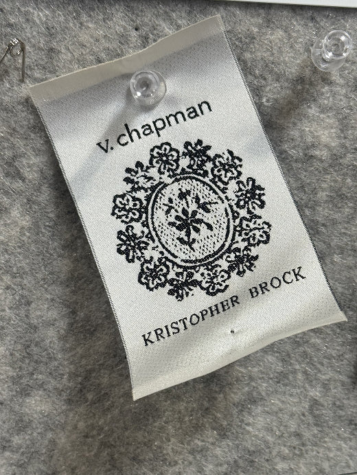 V. Chapman and Kristopher Brock woven label