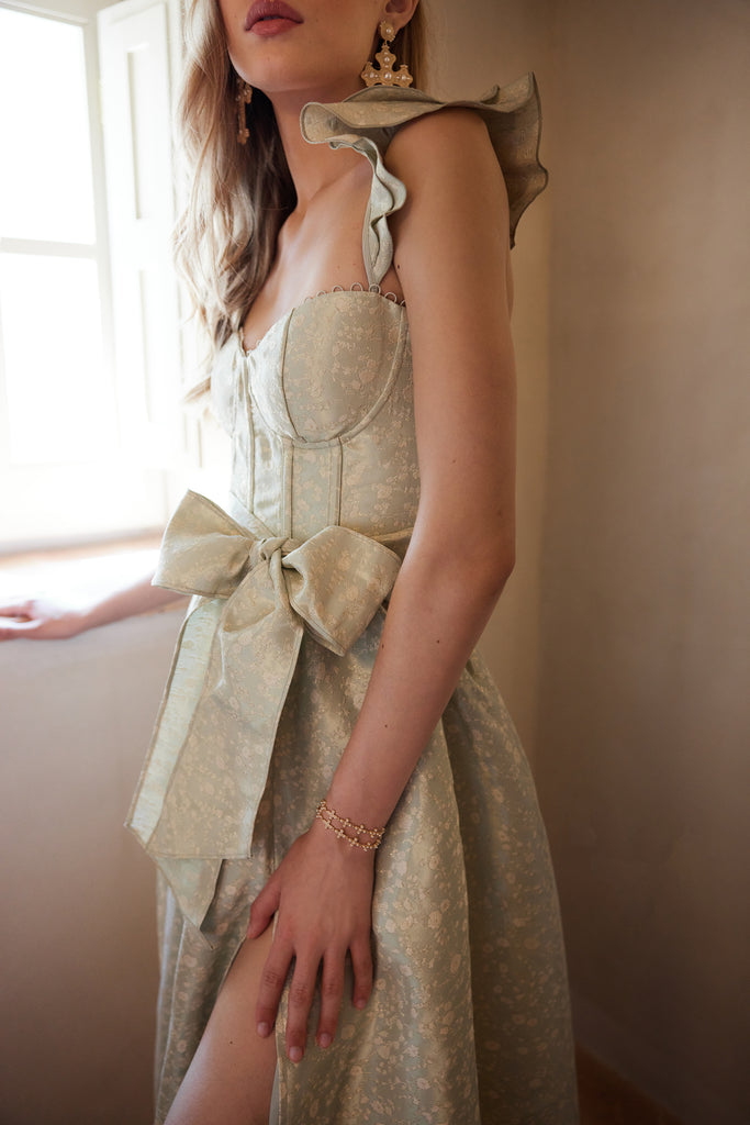 photo of model from the front in the vera dress in sage duchess