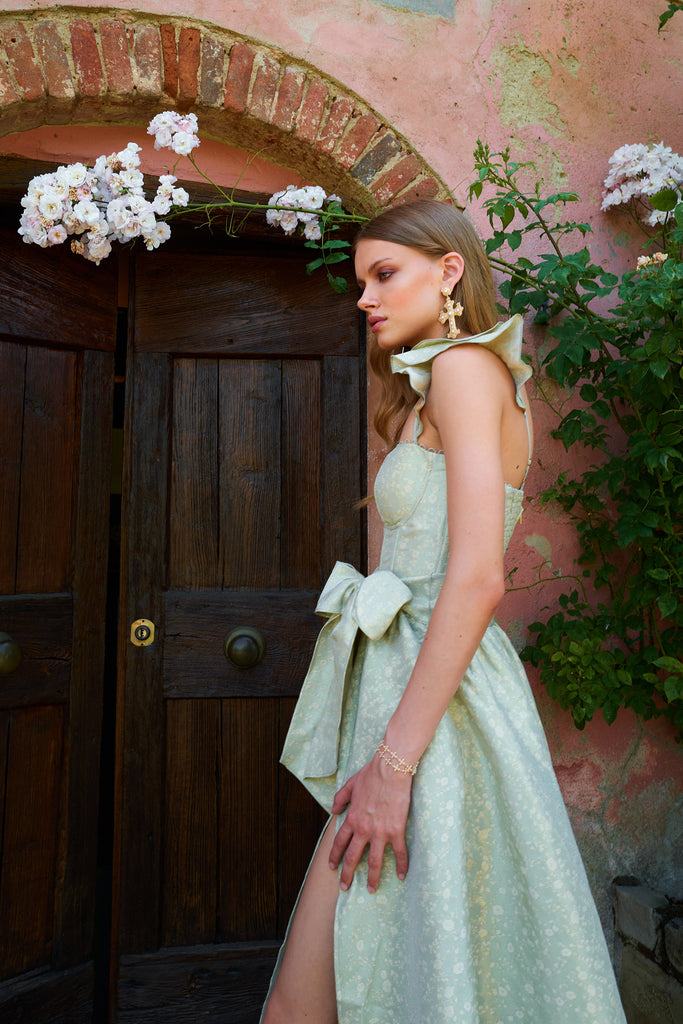 close up side view of model  in the vera dress in sage duchess
