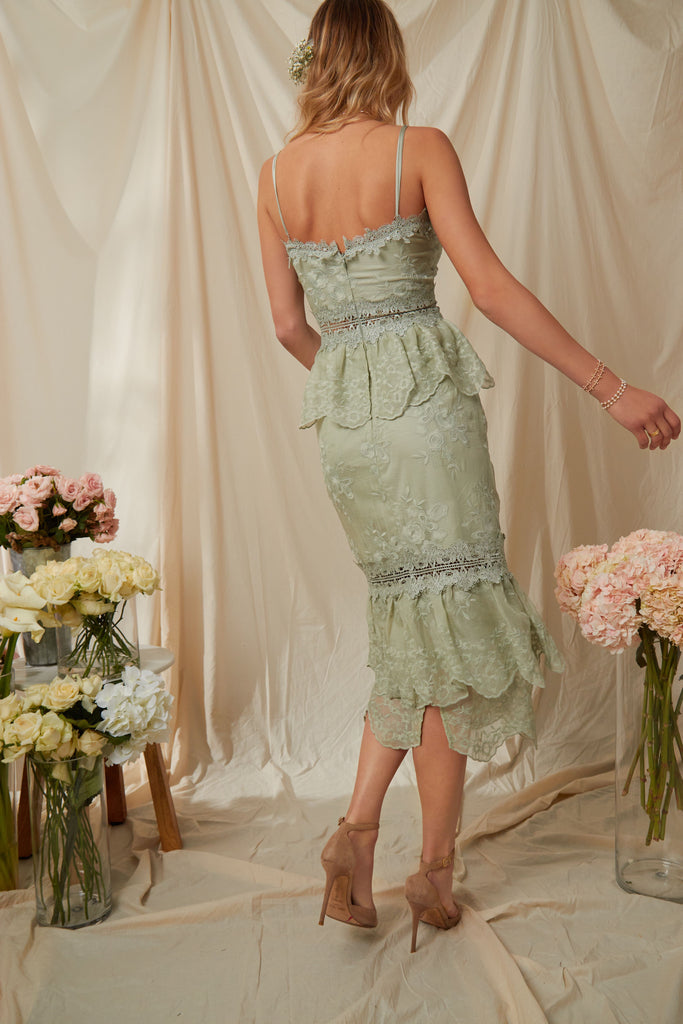 Full back view of model wearing The Dahlia Dress in Sage.