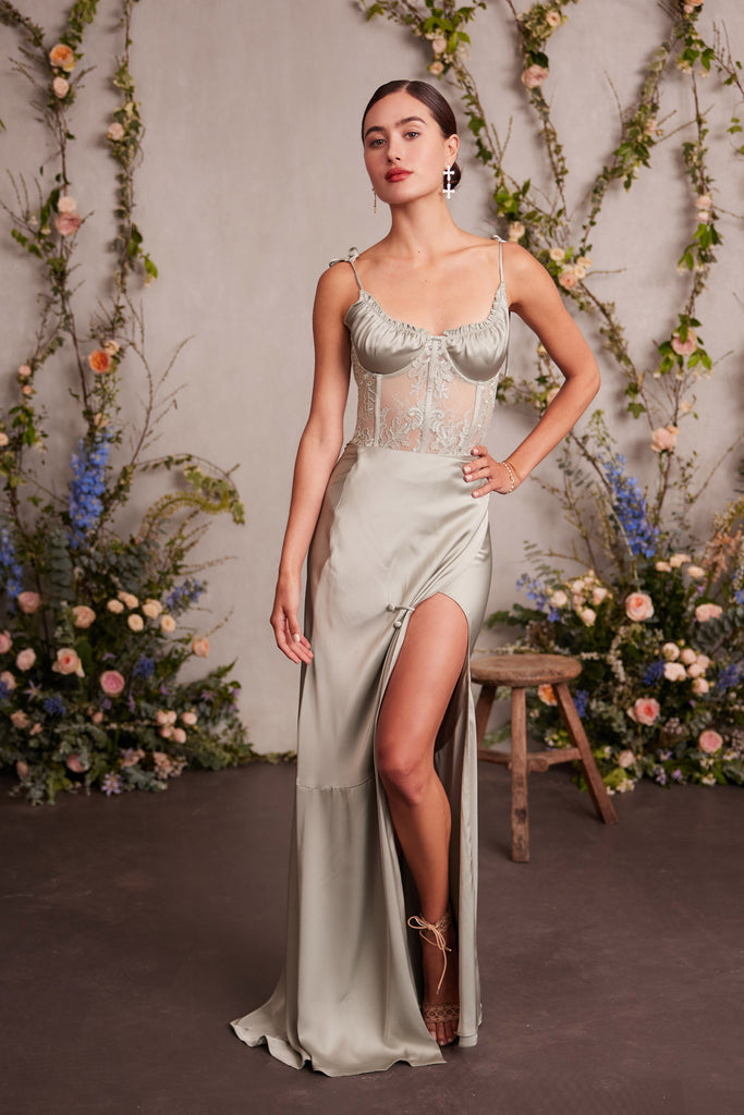 full front view of model wearing the calla lily dress in sage.