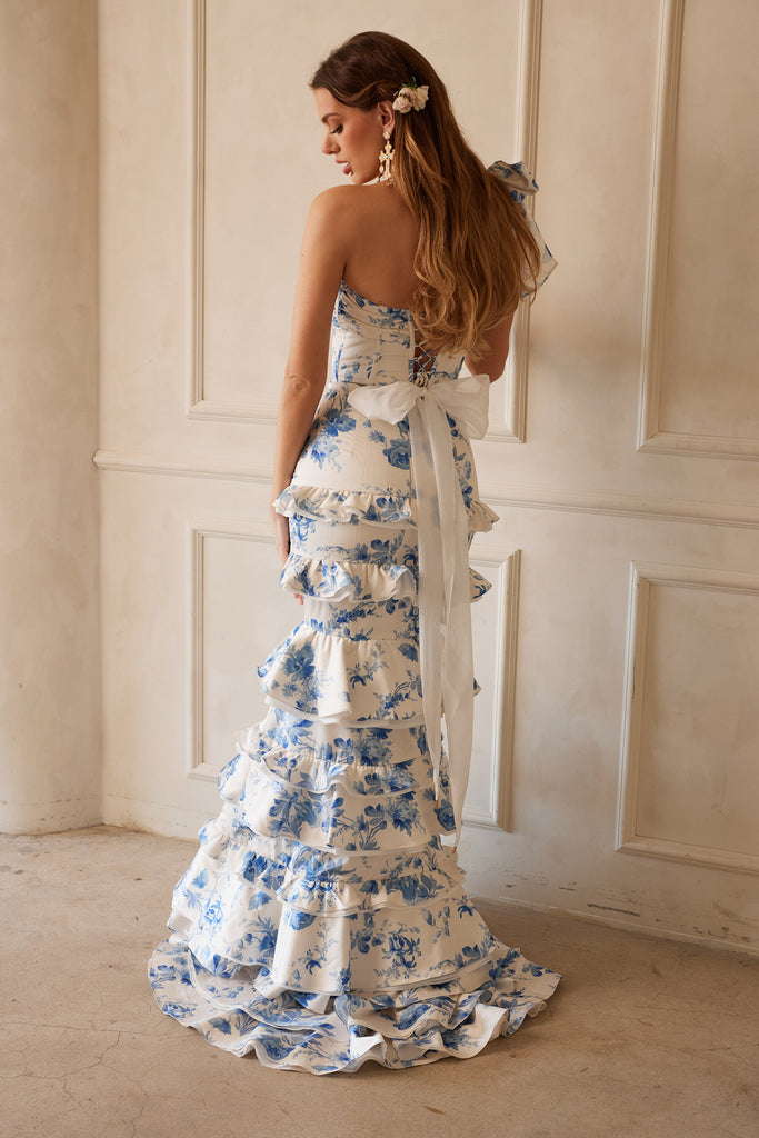 Full back view of model wearing The Barcelona set in Provencal Blue Floral. Model standing in front of white wall.