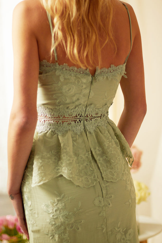 Up close back view of model wearing The Dahlia Dress in Sage.