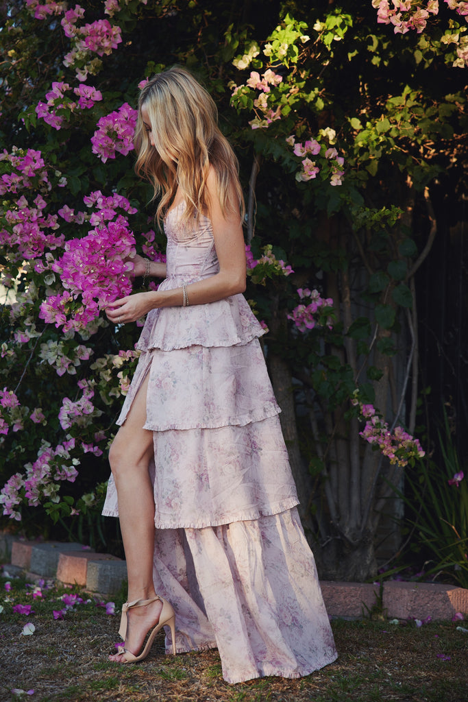 walking partial side view of model wearing The Caterina Dress in Blush Bouquet.