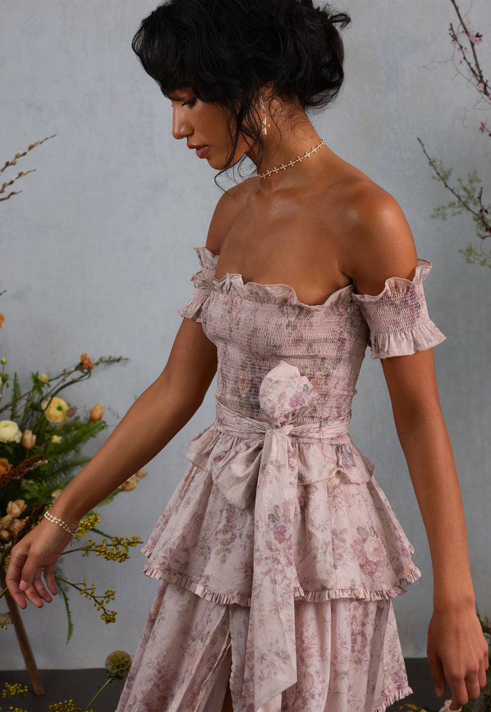 3/4 side view of model wearing angelina dress in blush bouquet