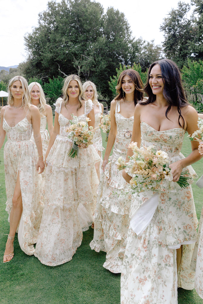 customer photo of 6 bridesmaids wearing various dresses in carmel valley rose print.