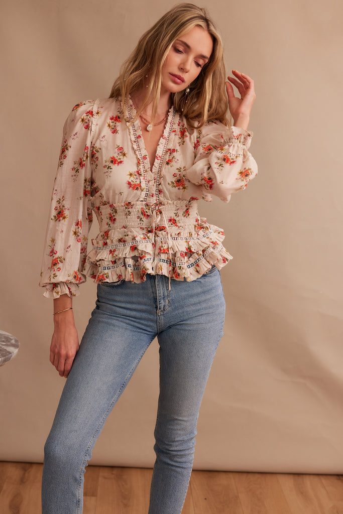 Front view of model wearing The Allegra Top in Natural Dainty Floral with jeans