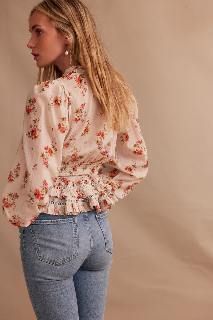 back view of model wearing allegra top in natural dainty floral with jeans 