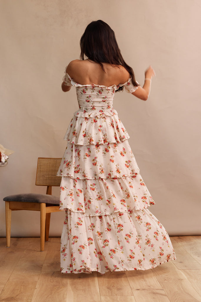 full back view of model wearing angelina dress in natural dainty floral.