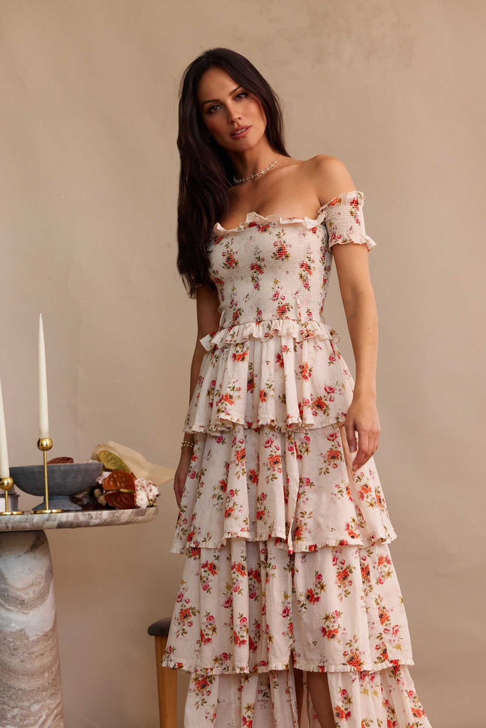 partial front view of model wearing angelina dress in natural dainty floral.