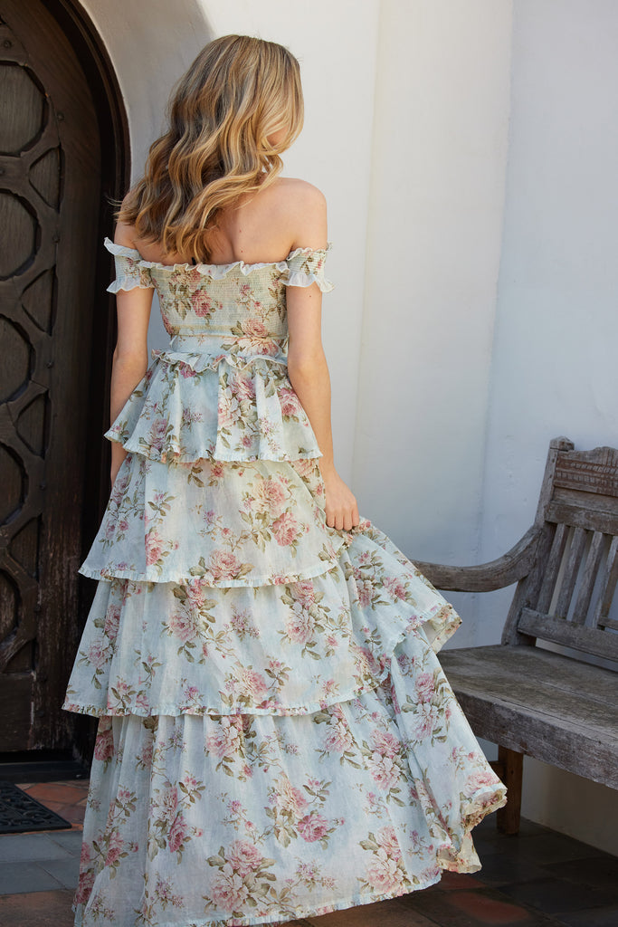 full back view of model wearing the angelina dress in tapestry rose print.