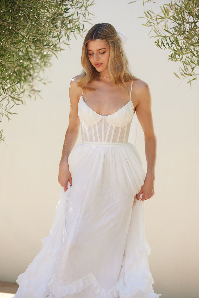 front view of model wearing carmen dress in white.