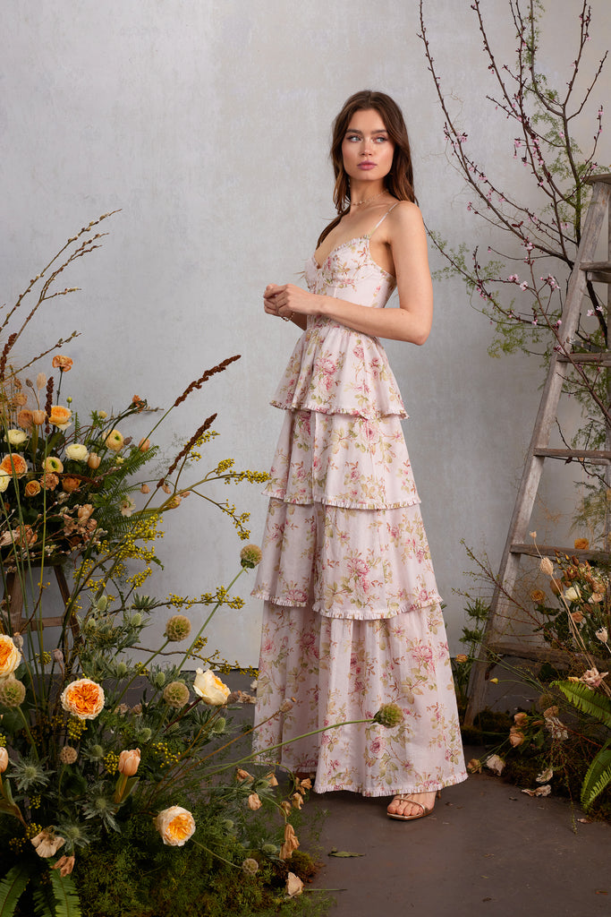 Full side view of model wearing The Caterina Dress in Pink Rose Print.