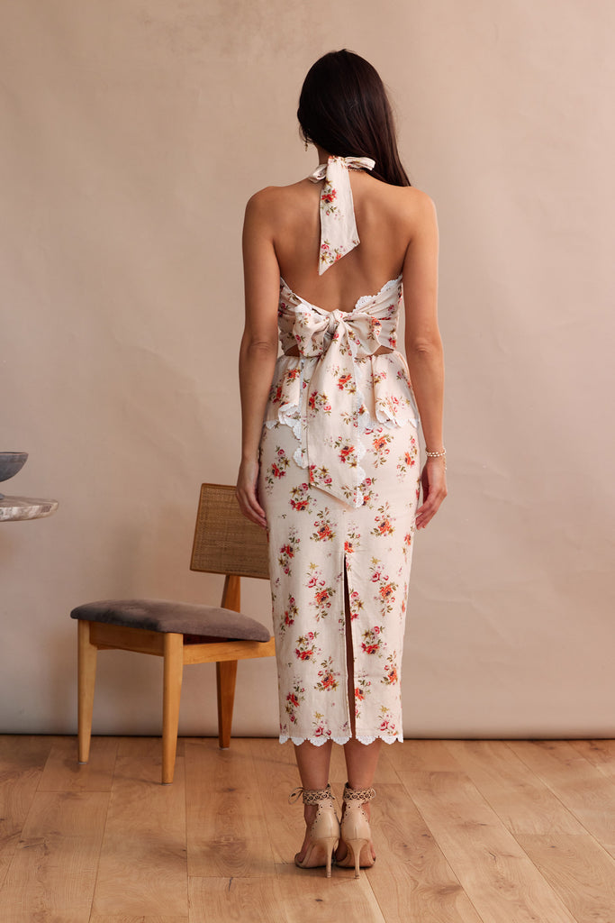 Full back view of model wearing The Daisy Dress in Natural Dainty Floral.