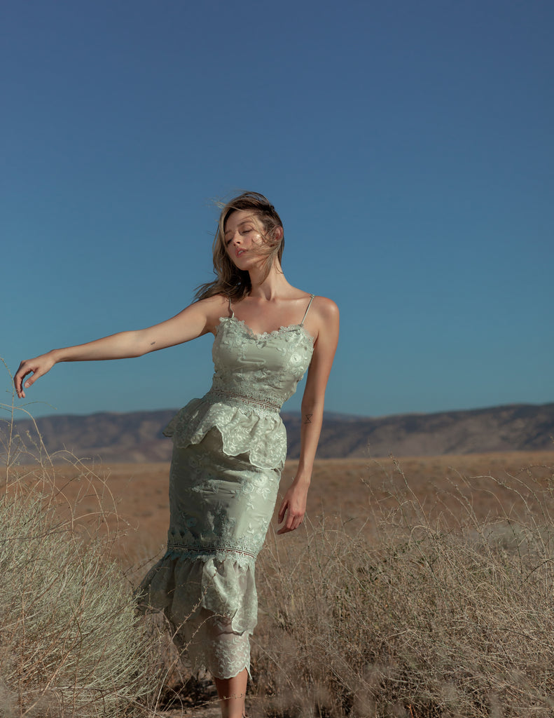 Full front view of model wearing The Dahlia Dress in Sage.